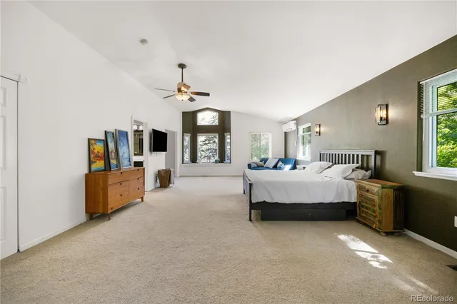 a bed room with furniture and window