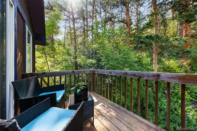 a view of balcony with furniture