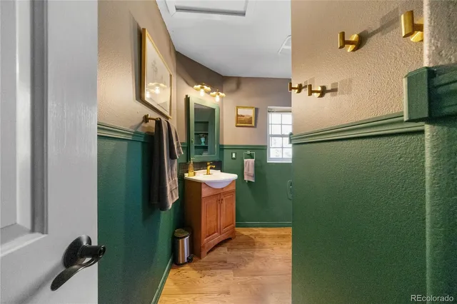 a bathroom with a sink a mirror and a shower