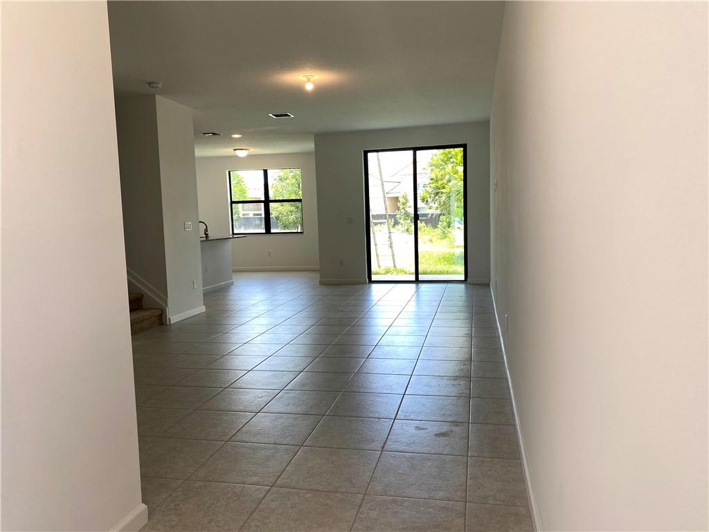 445 Northwest 33rd Lane Pompano Beach, FL 33069 - Photo 4 of 40 a view of an empty room and window