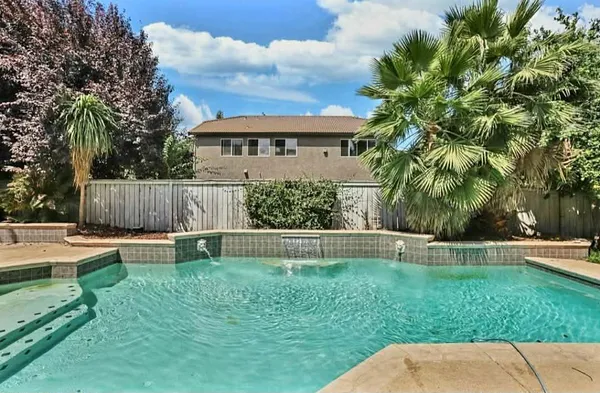 a view of a house with a back yard