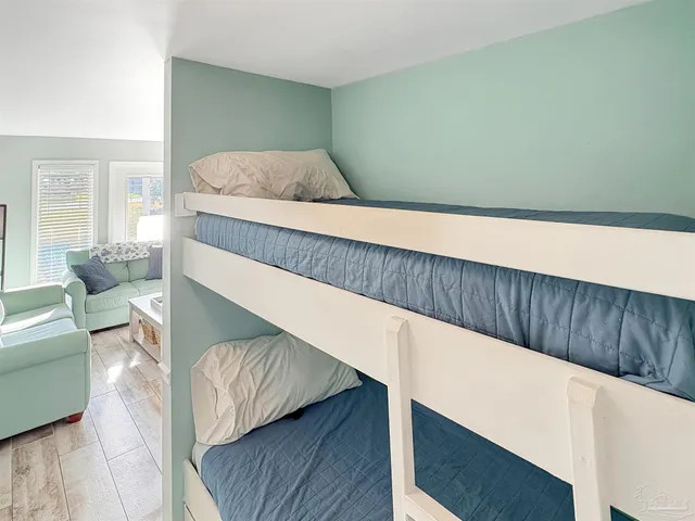 a bedroom with a bed and a couch