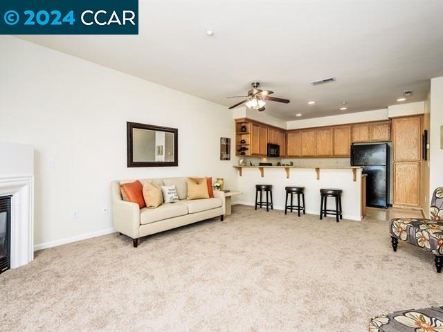 3666 Finnian Way Dublin, CA 94568 - Photo 6 of 17 a living room with furniture and kitchen view