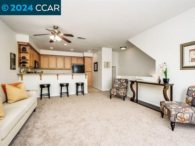 3666 Finnian Way Dublin, CA 94568 - Photo 7 of 17 a living room with furniture and kitchen view