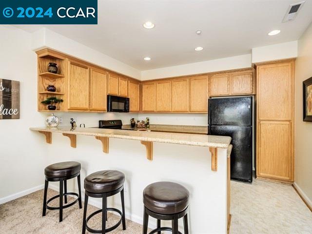 3666 Finnian Way Dublin, CA 94568 - Photo 8 of 17 a kitchen with stainless steel appliances granite countertop a refrigerator a stove a sink dishwasher and white countertops with wooden floor