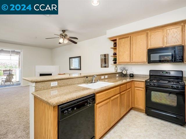 3666 Finnian Way Dublin, CA 94568 - Photo 9 of 17 a kitchen with a stove and a sink