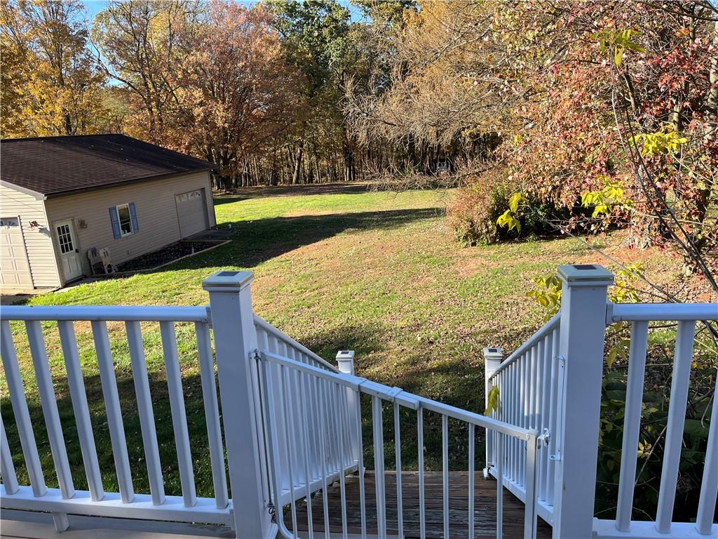 726 Lawsonham Road Rimersburg, PA 16248 - Photo 5 of 17 a view of a balcony with wooden floor and fence