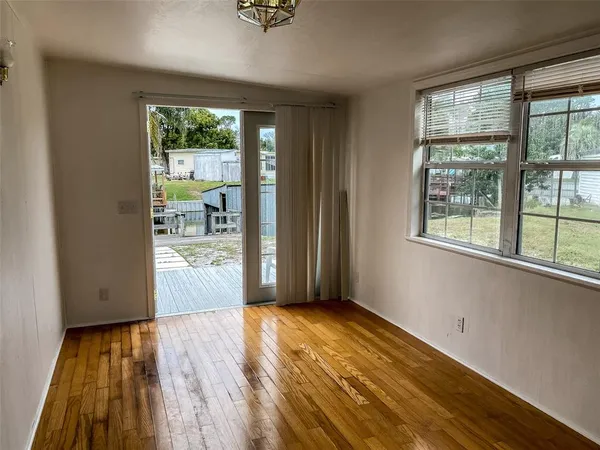 a view of an empty room with glass door