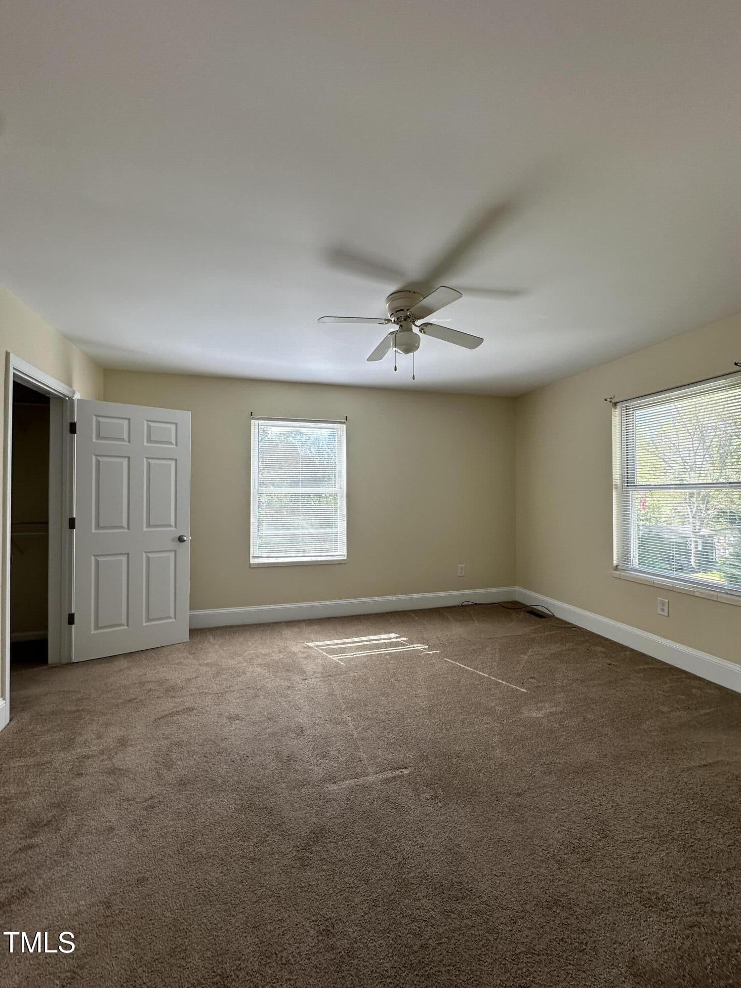 203 North 9th Street Mebane, NC 27302 - Photo 5 of 10 an empty room with windows and closet