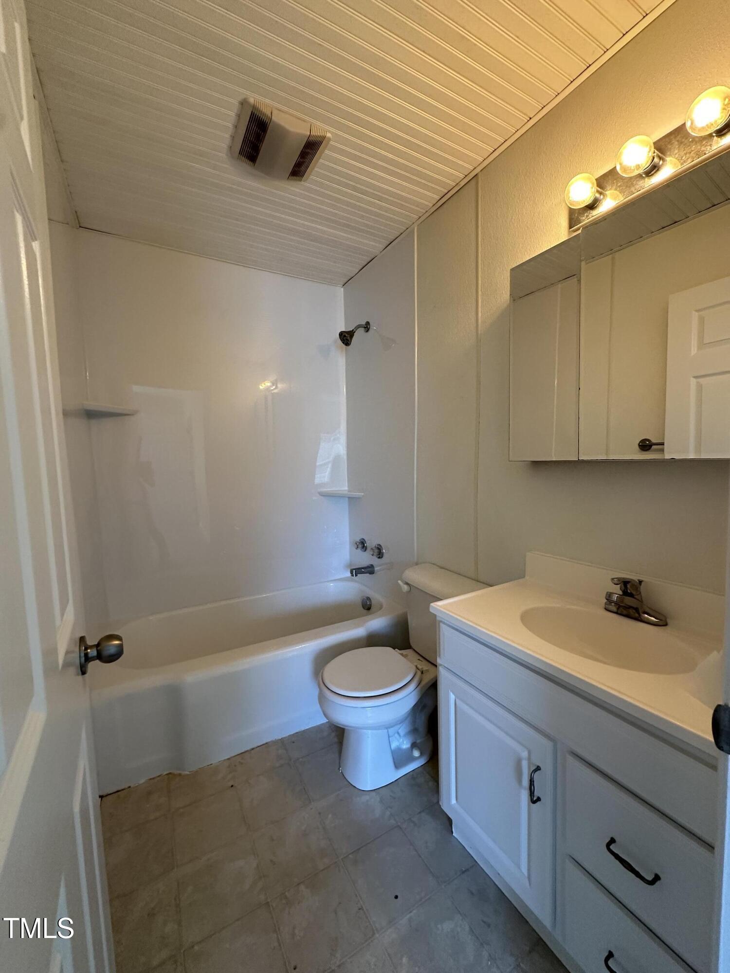 203 North 9th Street Mebane, NC 27302 - Photo 6 of 10 a bathroom with a sink a toilet and shower