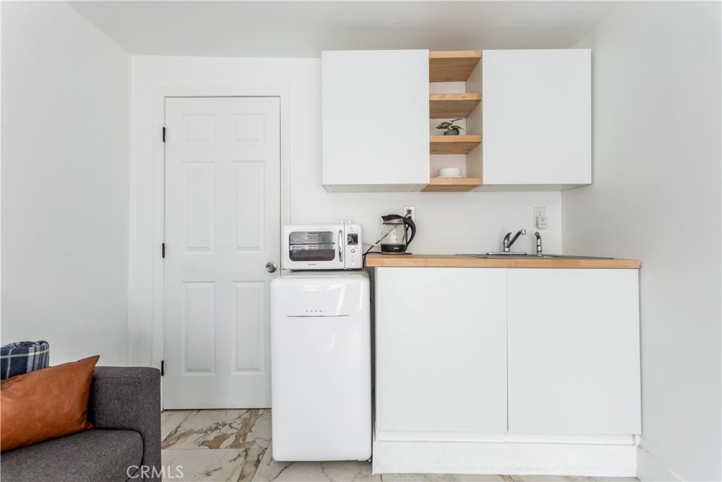 14818 Round Valley Drive, Unit C Sherman Oaks, CA 91403 - Photo 5 of 8 a room with storage and utility