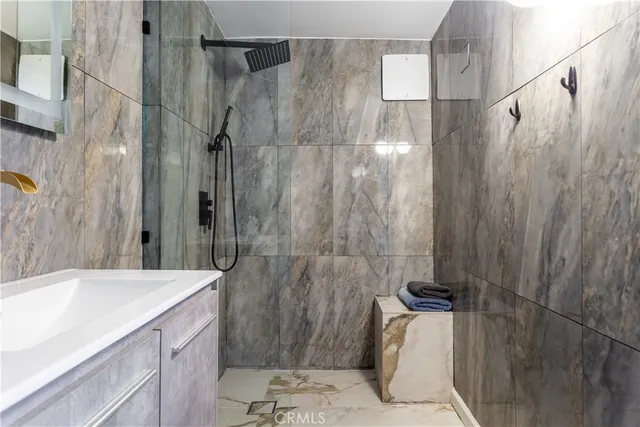 a bathroom with a sink and shower