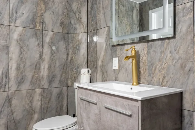 a bathroom with a sink and toilet