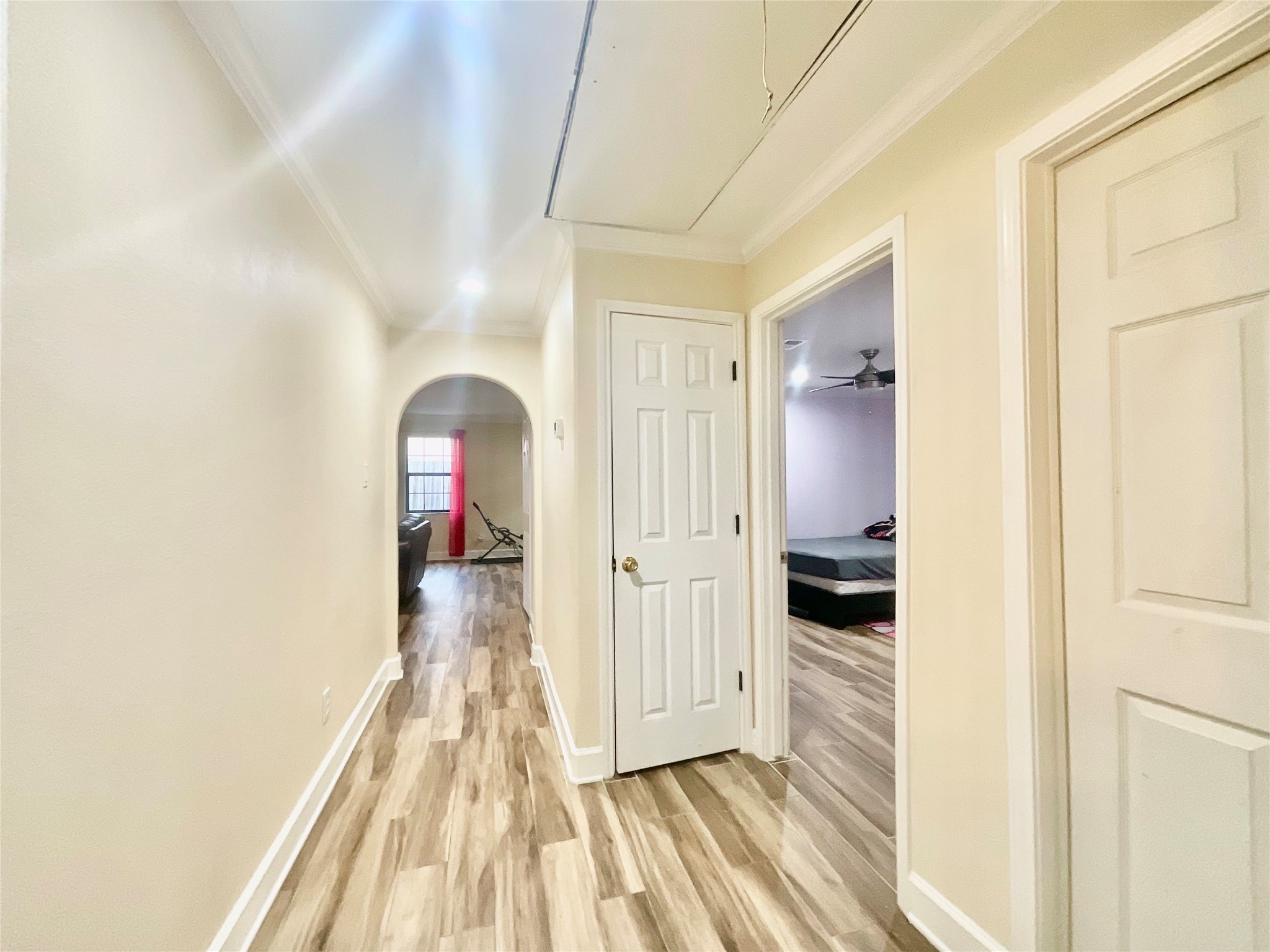 9213 Madera Road Houston, TX 77078 - Photo 11 of 15 a view of a hallway with wooden floor and staircase