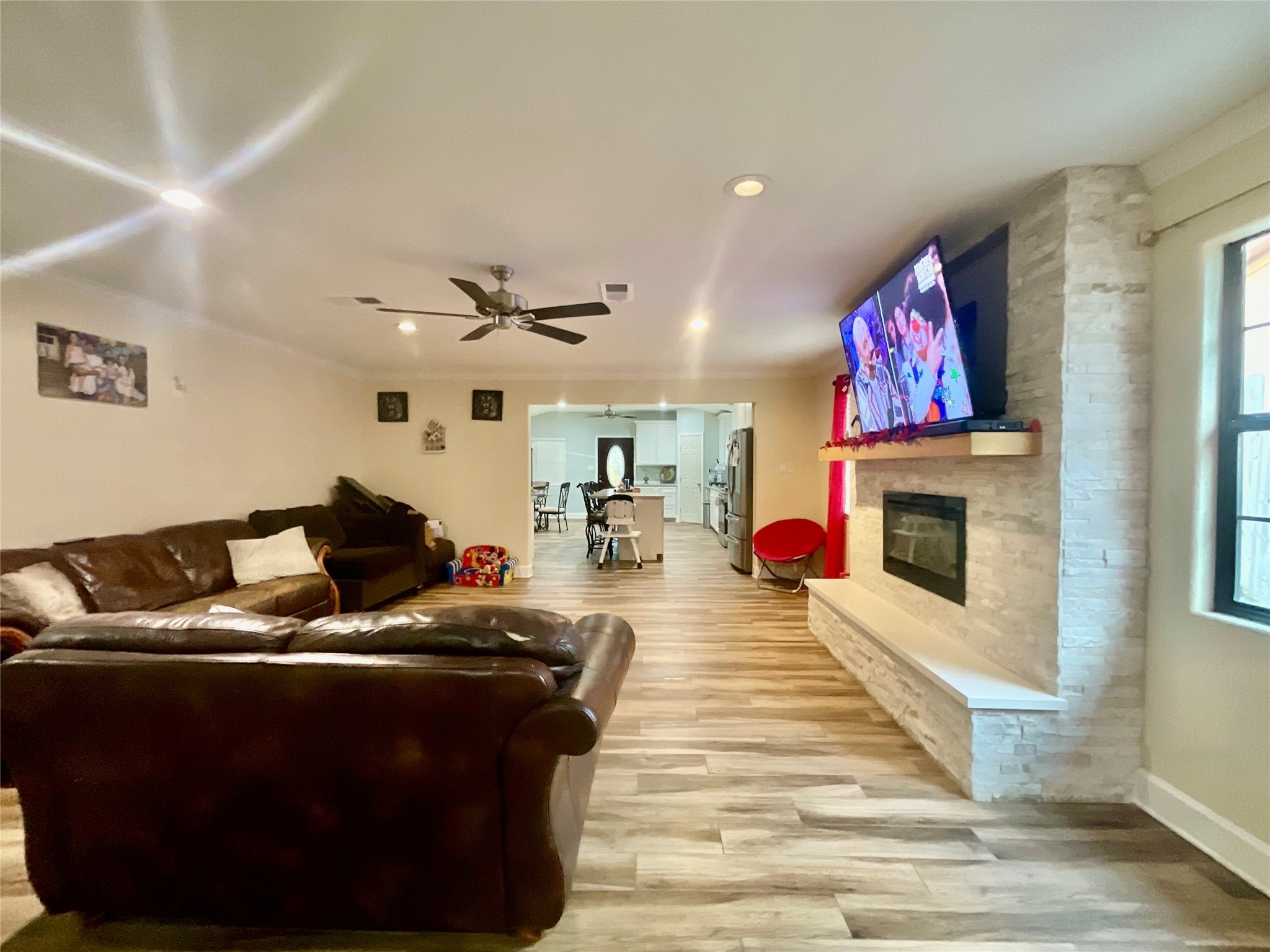 9213 Madera Road Houston, TX 77078 - Photo 5 of 15 a living room with furniture and a fireplace