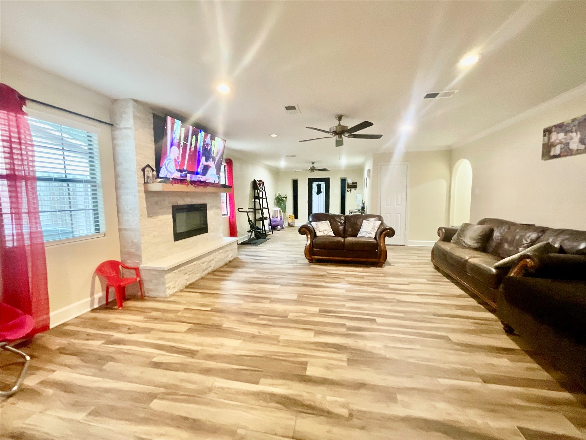 9213 Madera Road Houston, TX 77078 - Photo 8 of 15 a bed room with a bed furniture and a fireplace