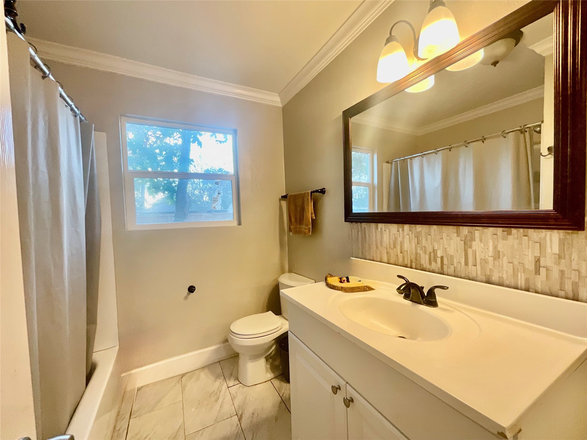 9213 Madera Road Houston, TX 77078 - Photo 10 of 15 a bathroom with a sink and a mirror