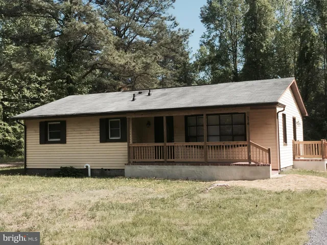 a house with trees in the background