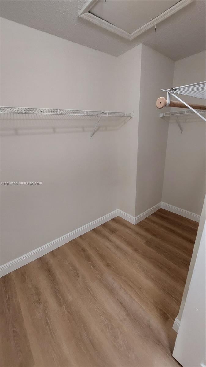 7083 Southwest 158th Court Miami, FL 33193 - Photo 17 of 22 a view of small space with racks on the wall
