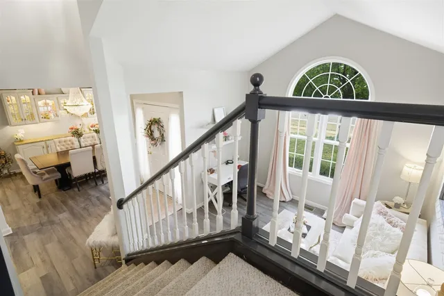 a view of an entryway with wooden floor