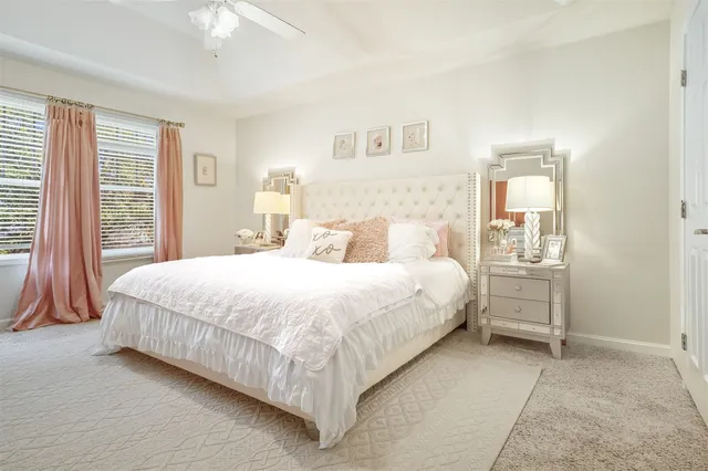 a bedroom with a bed and a mirror