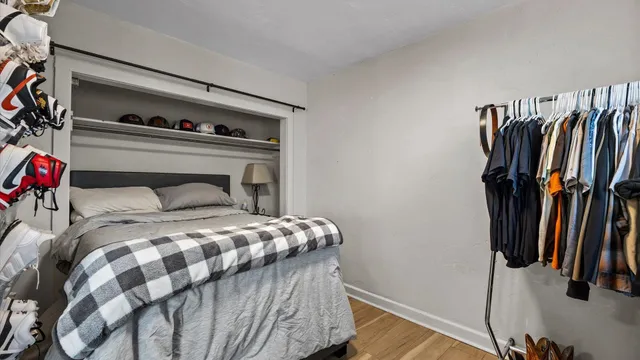 a bedroom with a bed and a closet