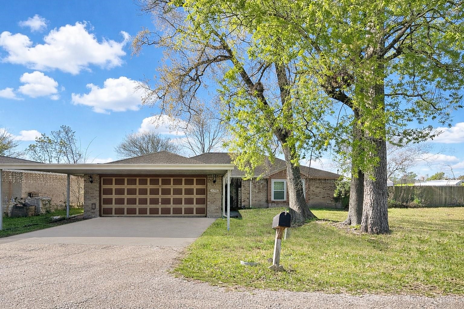 16230 Katherine Lane Channelview, TX 77530 - Photo 1 of 18 a front view of a house with a yard