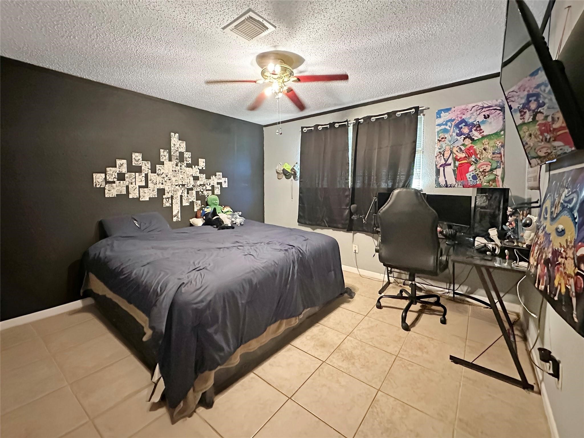 16230 Katherine Lane Channelview, TX 77530 - Photo 12 of 18 a bedroom with a bed mirror dresser and a window