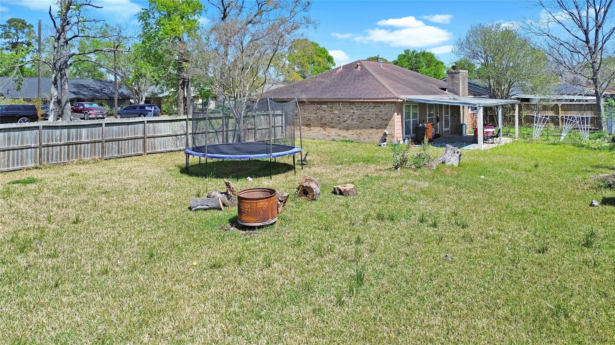 16230 Katherine Lane Channelview, TX 77530 - Photo 16 of 18 a view of a house with backyard and sitting area