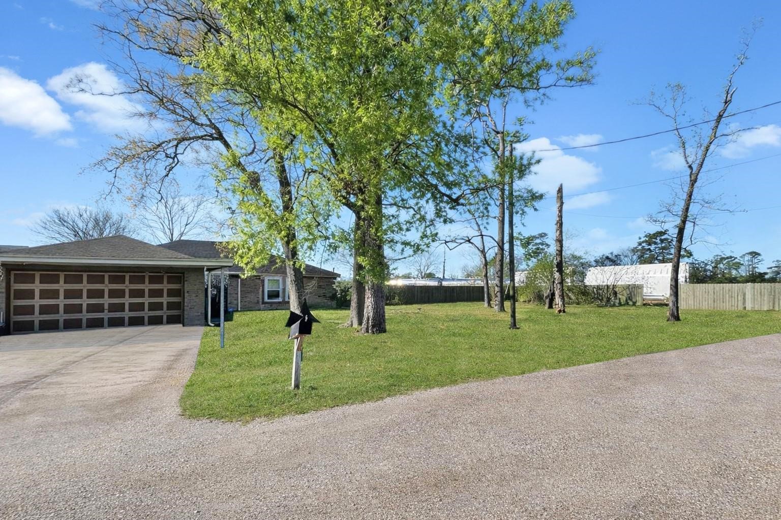 16230 Katherine Lane Channelview, TX 77530 - Photo 2 of 18 a view of a park with large trees