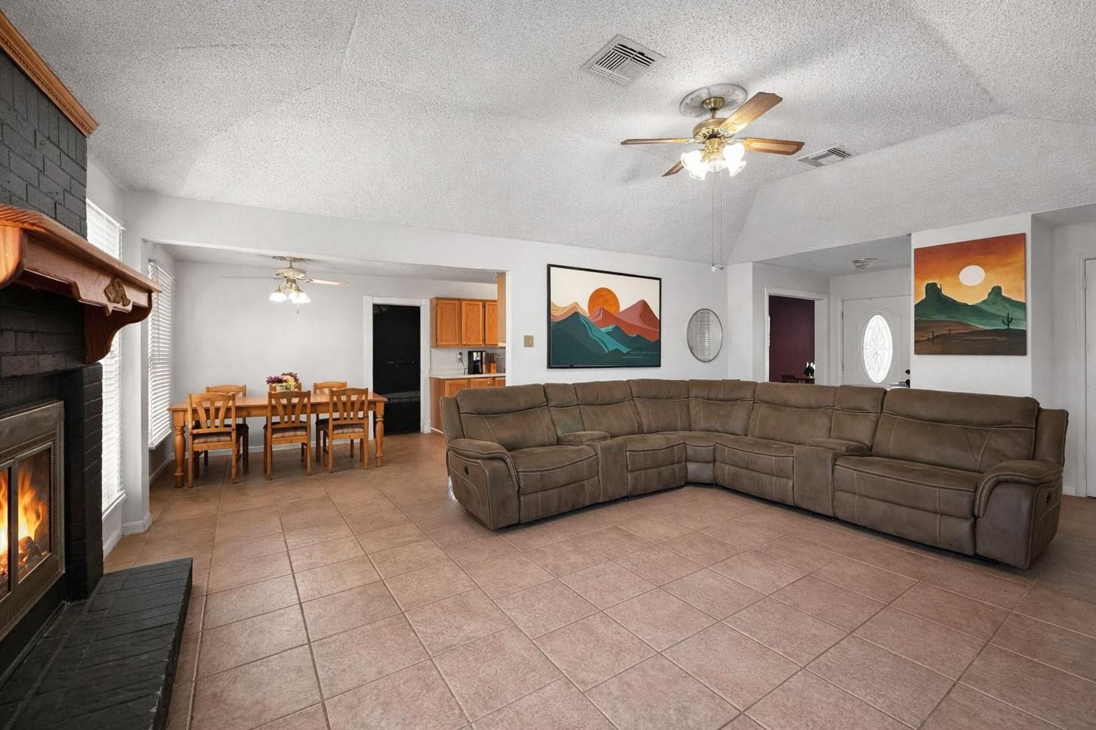 16230 Katherine Lane Channelview, TX 77530 - Photo 6 of 18 a living room with furniture and a flat screen tv