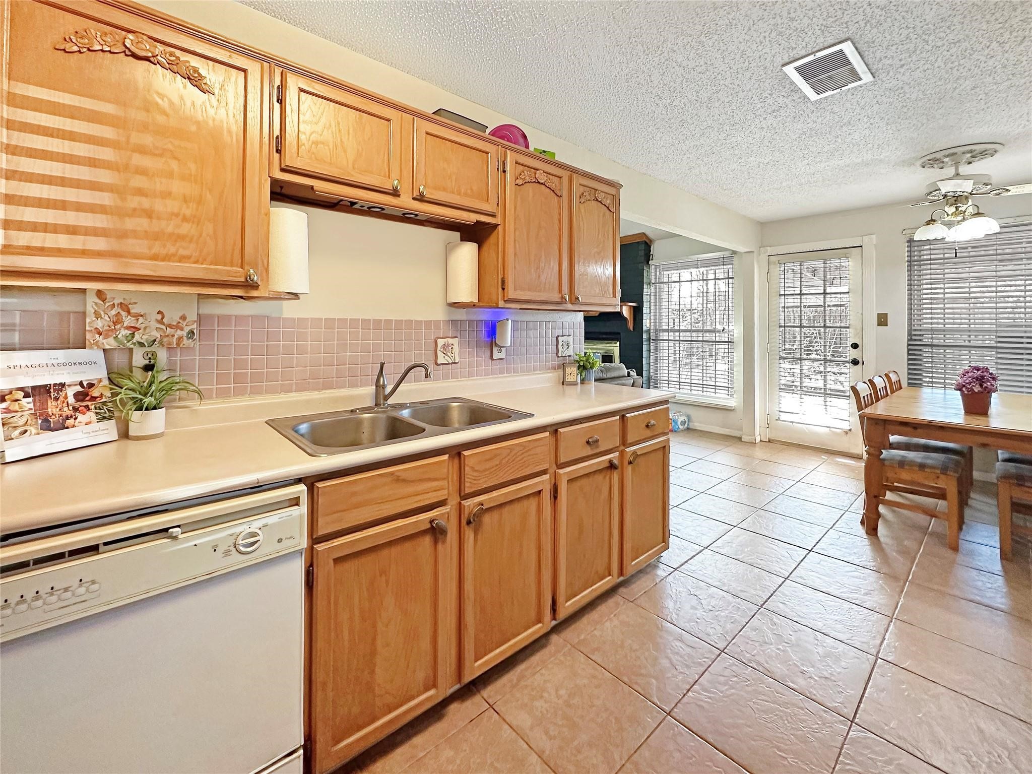 16230 Katherine Lane Channelview, TX 77530 - Photo 7 of 18 a kitchen with a sink and cabinets