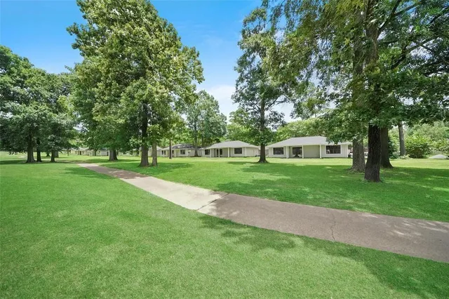 a view of a house with a big yard