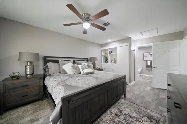 a bedroom with a bed and a mirror