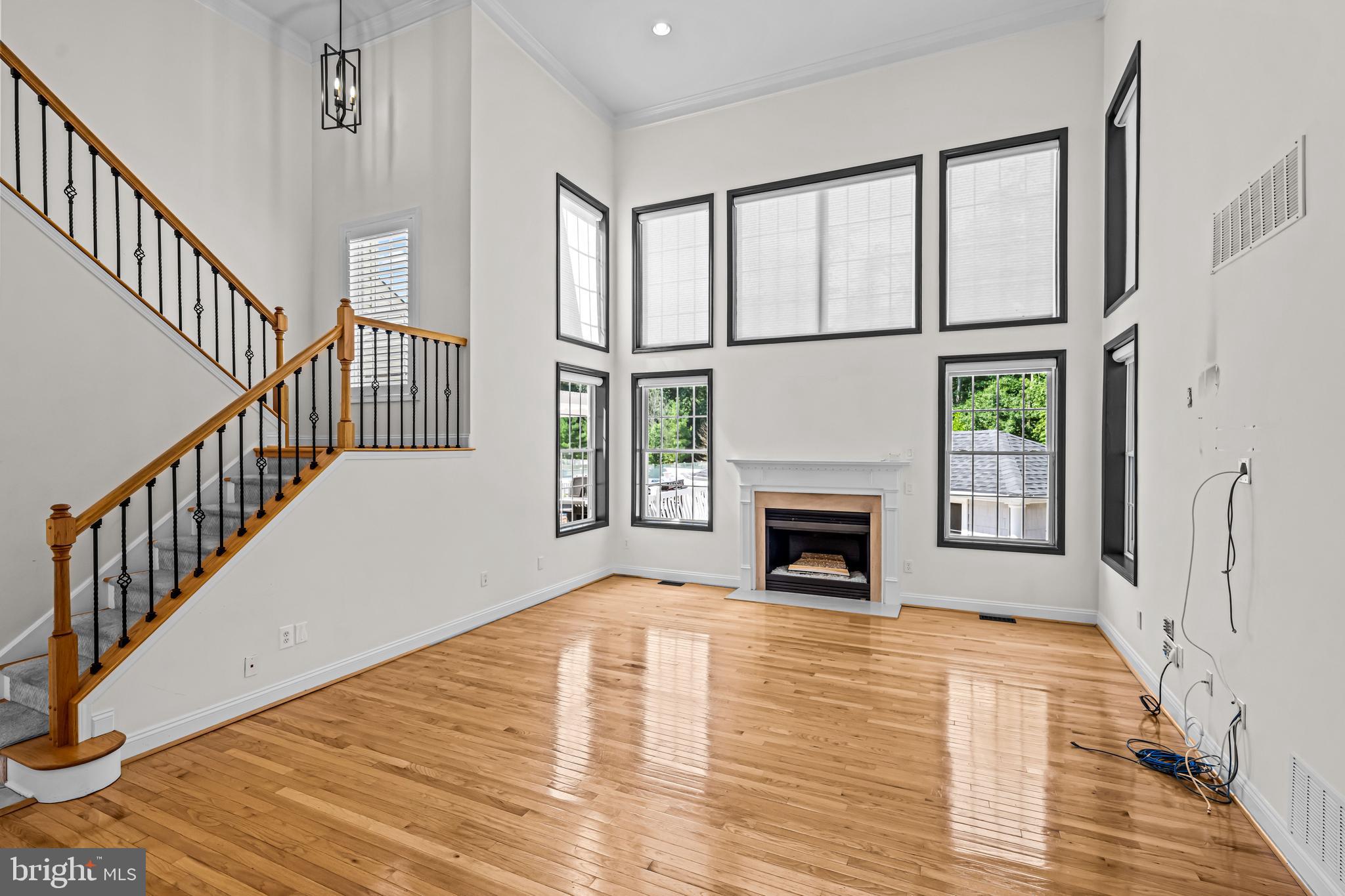 22 Tara Drive Sewell, NJ 08080 - Photo 32 of 70 a view of an empty room with wooden floor fireplace and a window