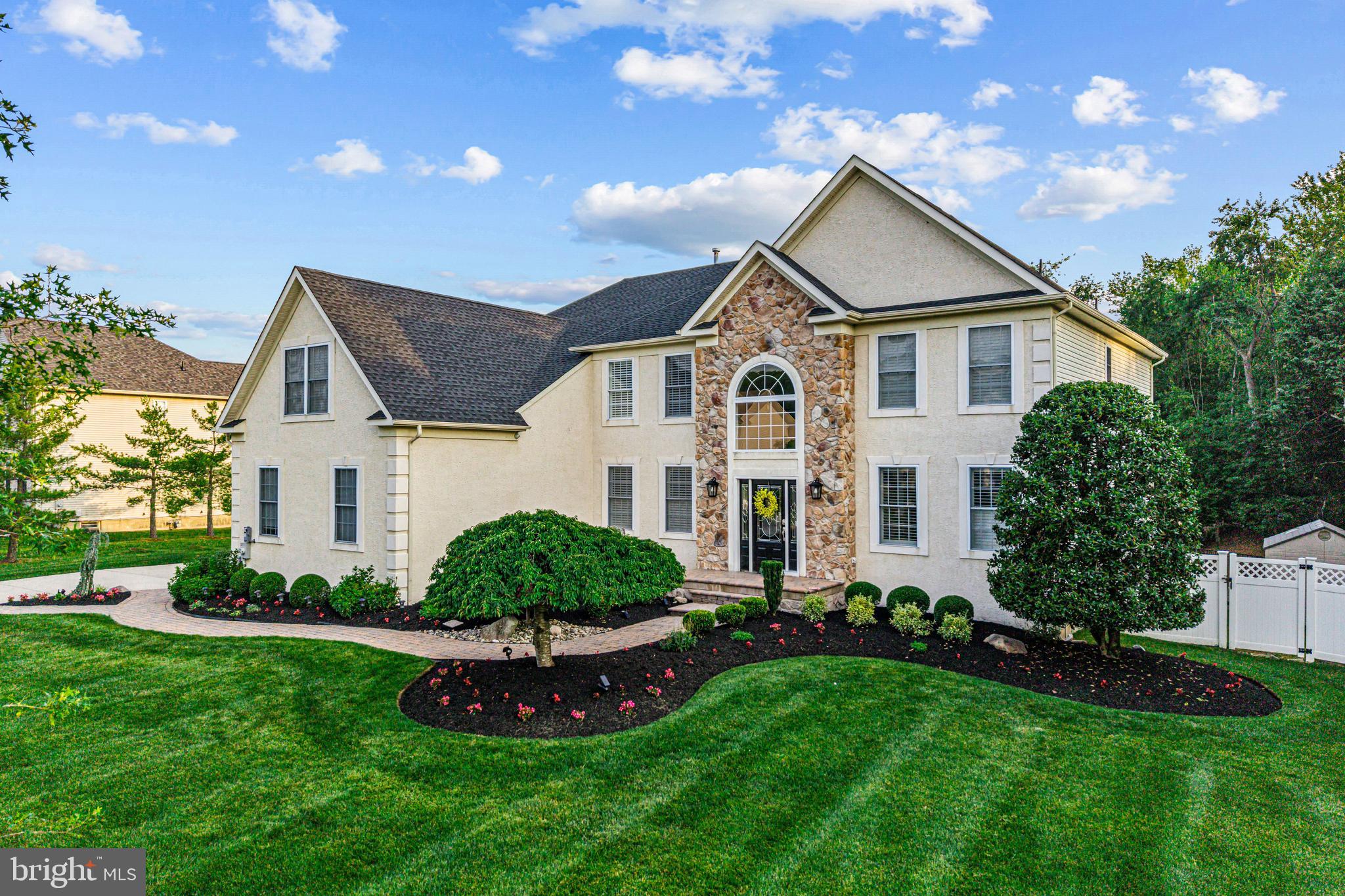 22 Tara Drive Sewell, NJ 08080 - Photo 4 of 70 a front view of a house with a yard and garage