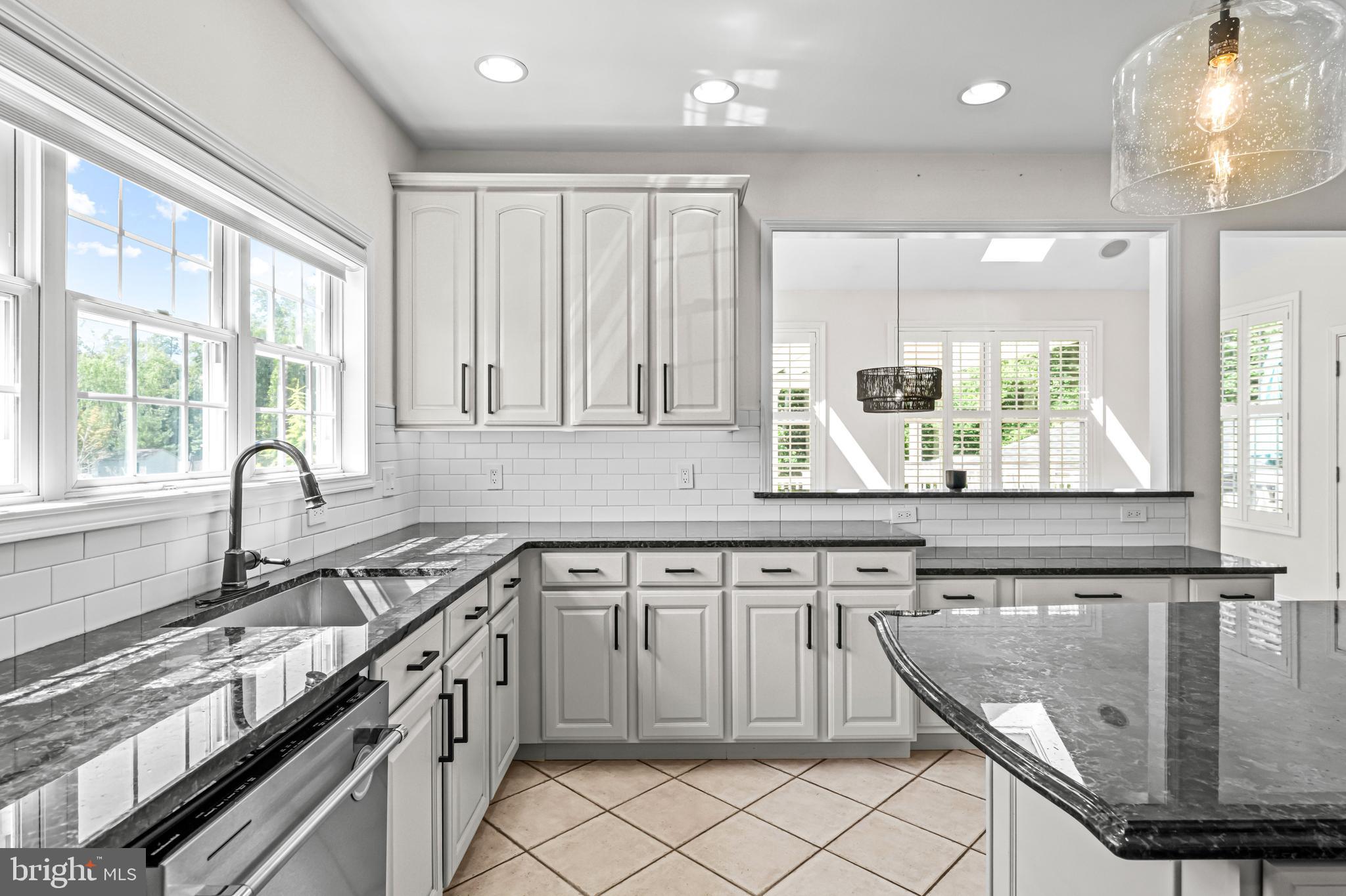 22 Tara Drive Sewell, NJ 08080 - Photo 43 of 70 a kitchen with stainless steel appliances granite countertop a sink and a stove