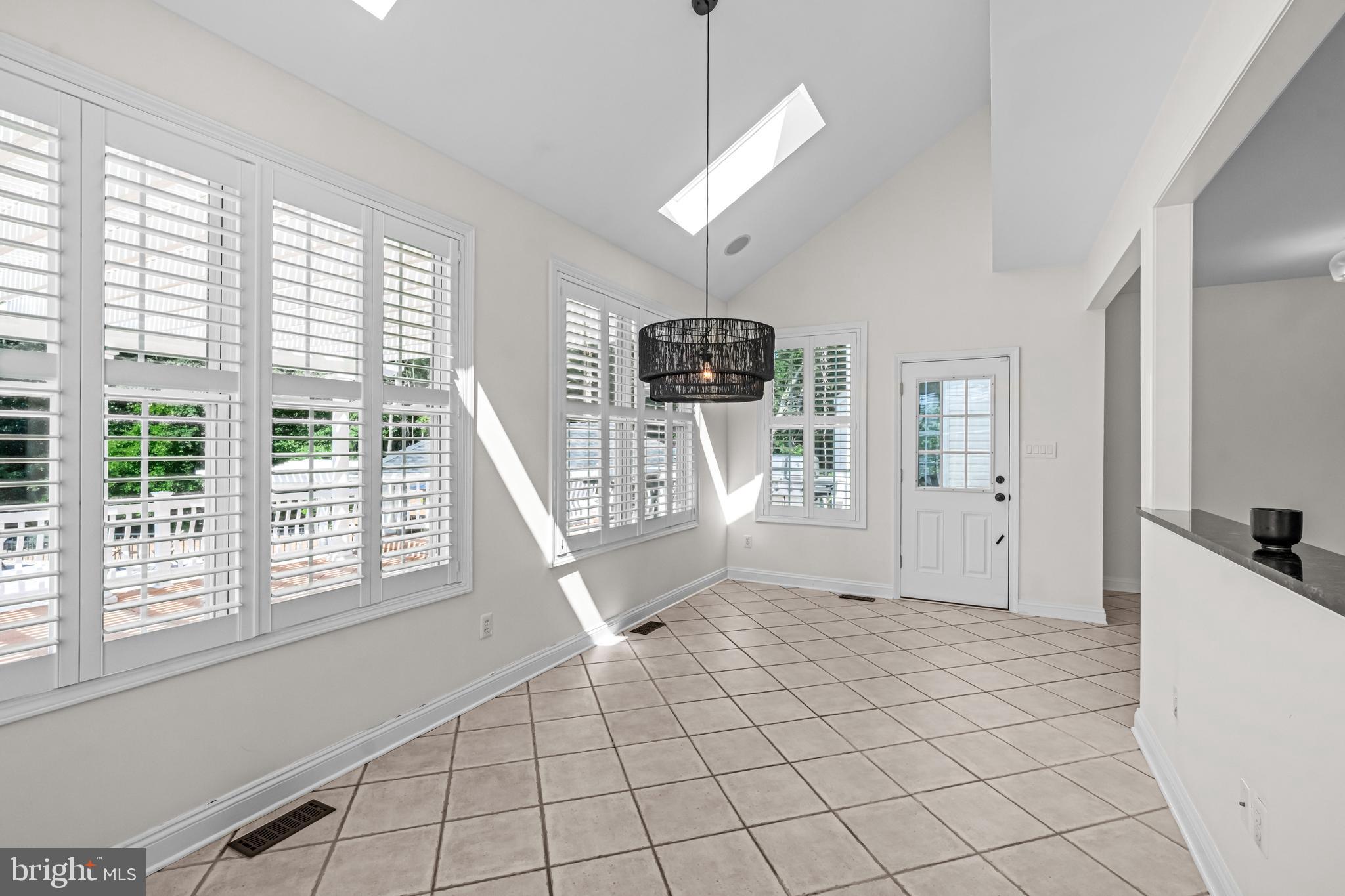 22 Tara Drive Sewell, NJ 08080 - Photo 46 of 70 a living room with furniture a flat screen tv and a large window