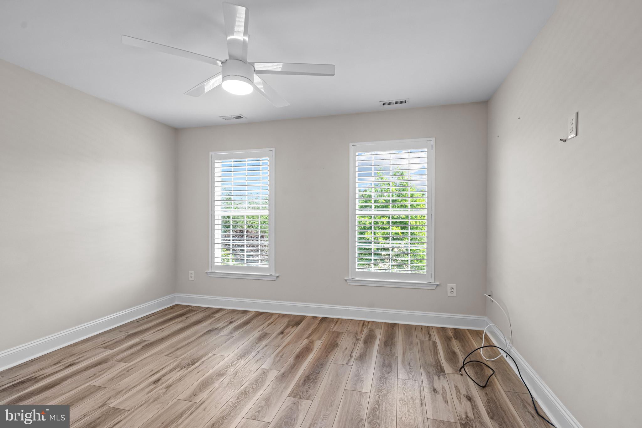 22 Tara Drive Sewell, NJ 08080 - Photo 50 of 70 a view of an empty room with wooden floor and a window