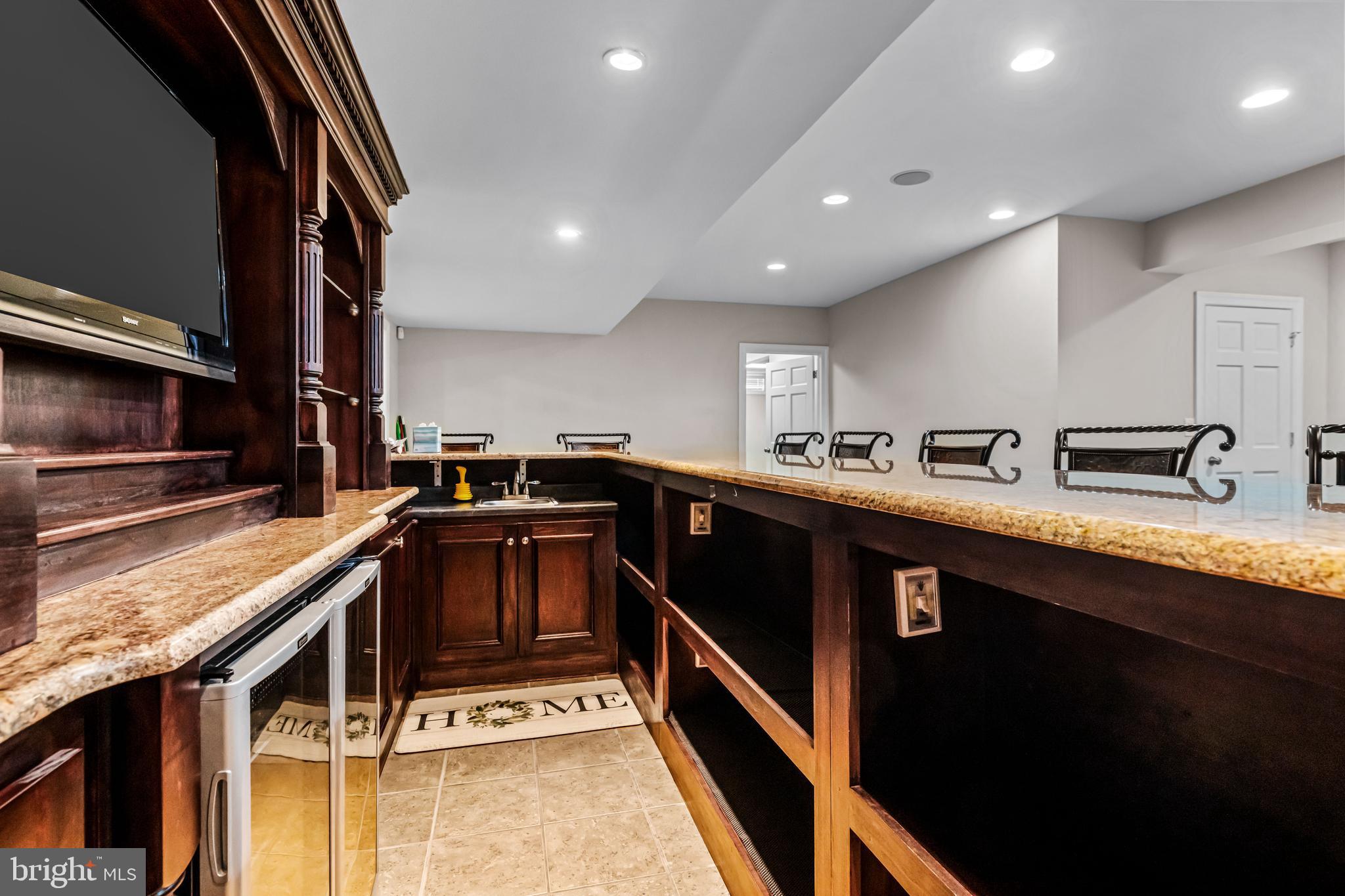 22 Tara Drive Sewell, NJ 08080 - Photo 69 of 70 a kitchen with stainless steel appliances granite countertop a sink stove and cabinets
