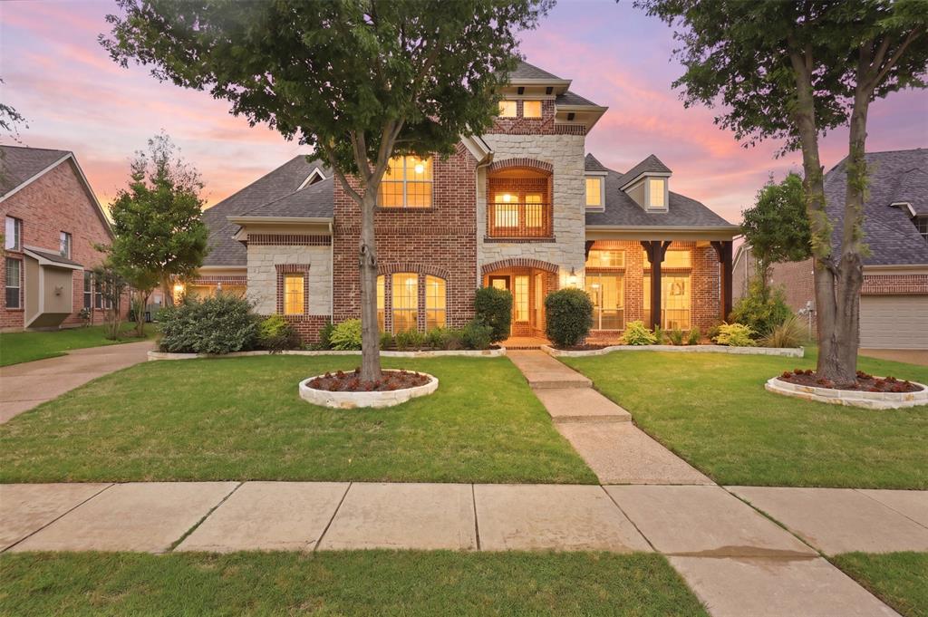 2841 Meadow Ridge Drive Prosper, TX 75078 - Photo 1 of 40 a front view of a house with a yard