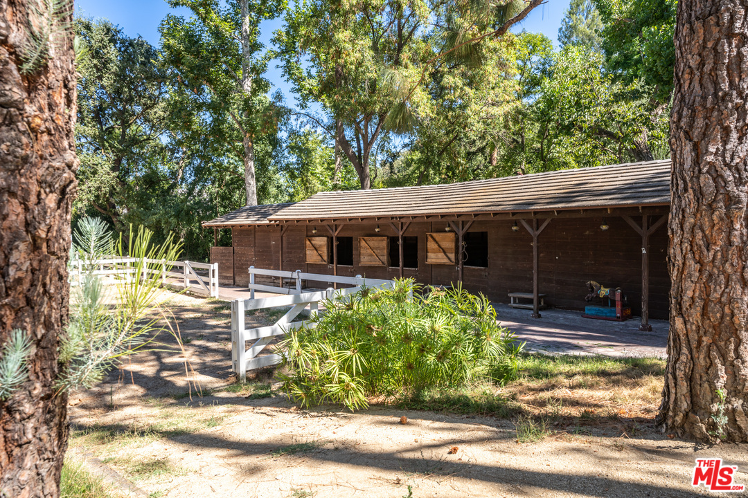 24878 Long Valley Road Hidden Hills, CA 91302 - Photo 3 of 54 a view of a house with backyard