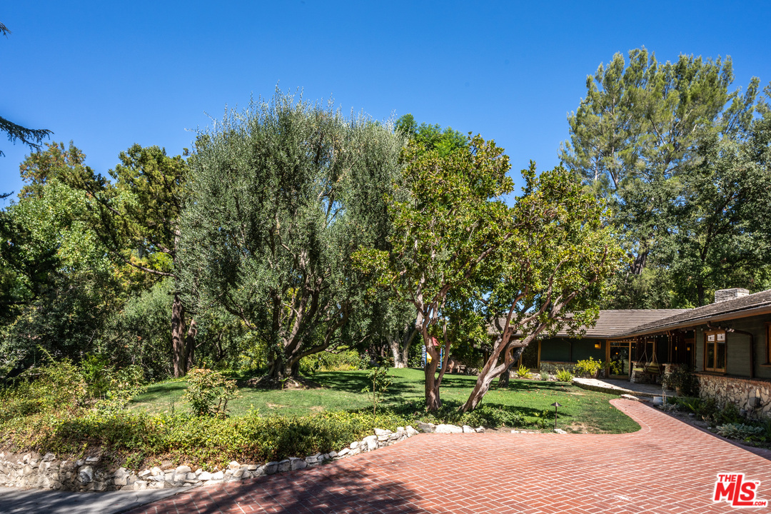 24878 Long Valley Road Hidden Hills, CA 91302 - Photo 22 of 54 a big yard with flowing stream of water in middle