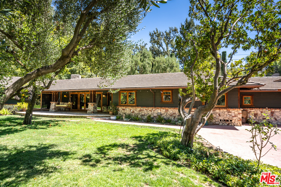 24878 Long Valley Road Hidden Hills, CA 91302 - Photo 24 of 54 a front view of a house with garden