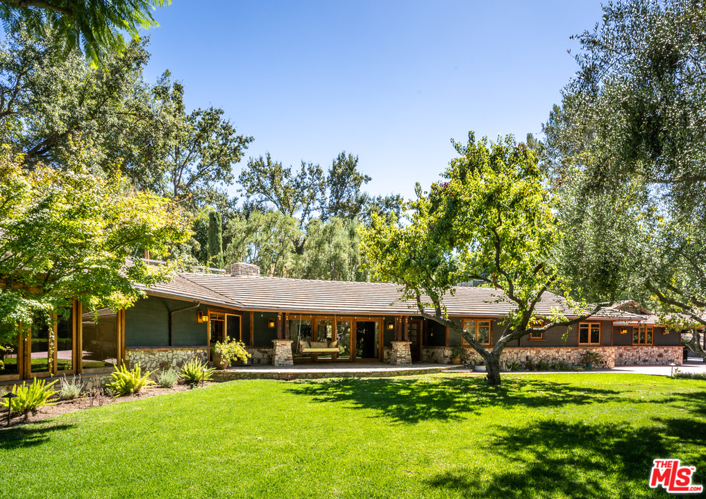 24878 Long Valley Road Hidden Hills, CA 91302 - Photo 25 of 54 a front view of a house with garden