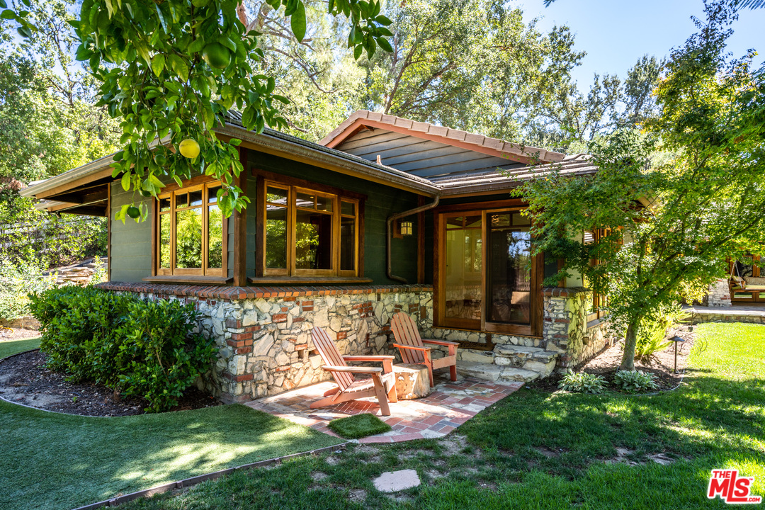 24878 Long Valley Road Hidden Hills, CA 91302 - Photo 26 of 54 a backyard of a house with yard and outdoor seating