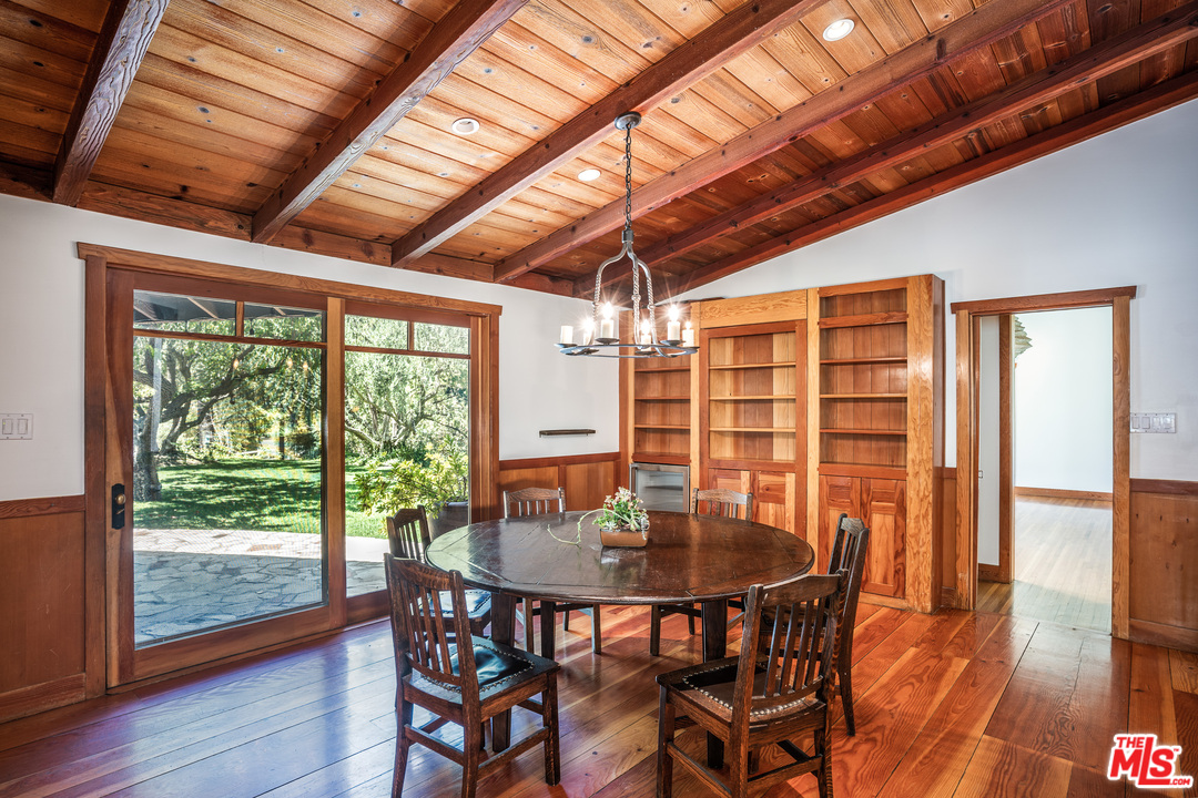 24878 Long Valley Road Hidden Hills, CA 91302 - Photo 30 of 54 a view of a dining room with furniture window and wooden floor