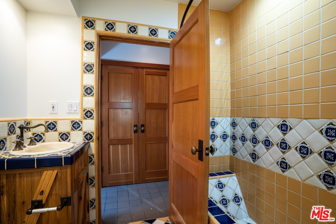 24878 Long Valley Road Hidden Hills, CA 91302 - Photo 40 of 54 a bathroom with a bathtub and shower