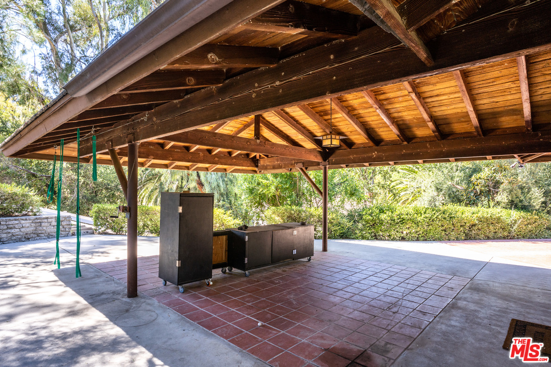 24878 Long Valley Road Hidden Hills, CA 91302 - Photo 51 of 54 a backyard of a house with a garden and outdoor seating