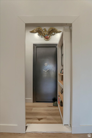828 South Deer Road Tooele, UT 84074 - Photo 26 of 51 Light wood-finish flooring extending into a discreetly recessed area, featuring a heavy-duty vault door